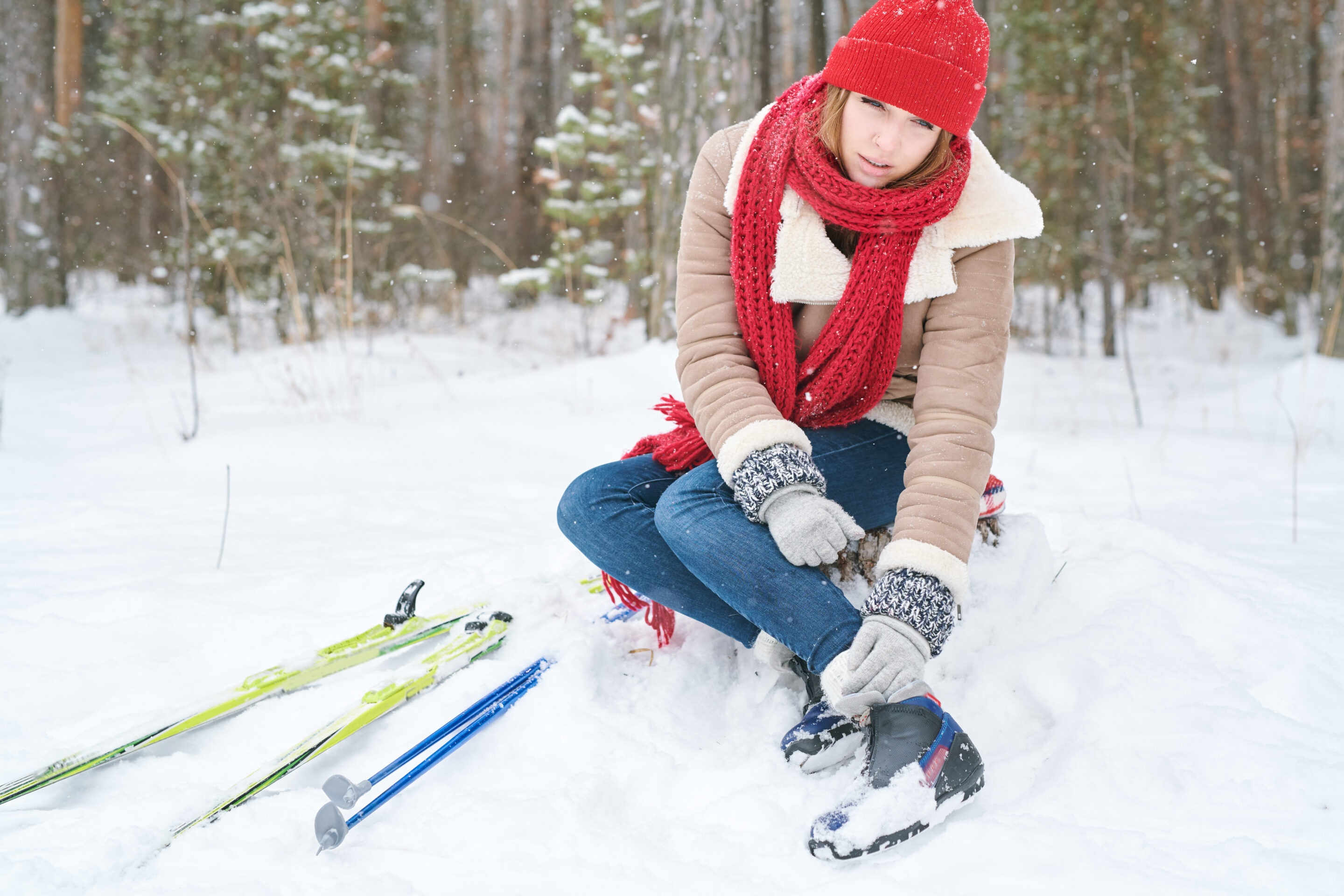 Woman with skiing winter sports injuries