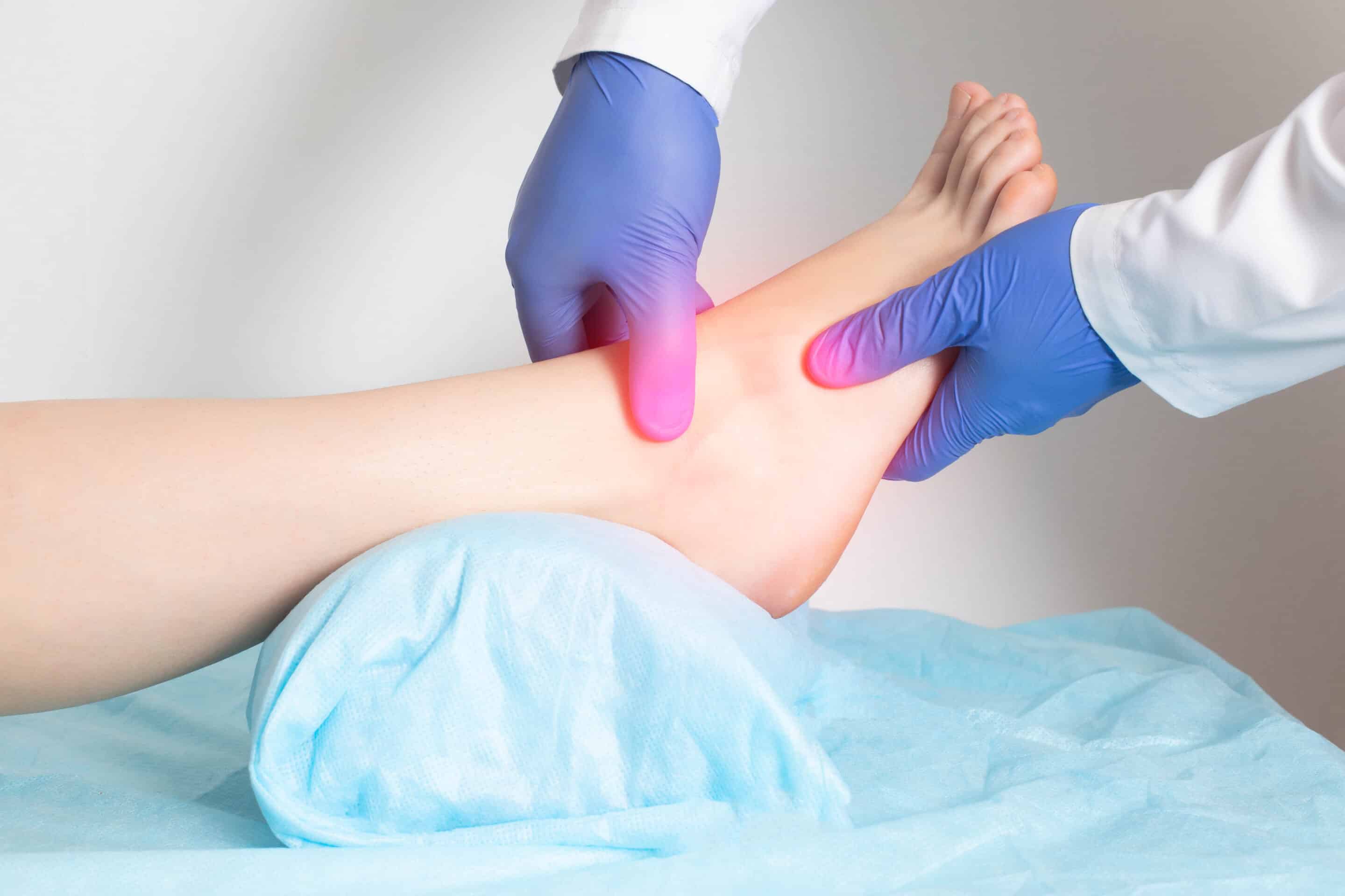 Doctor examines foot with heel pain